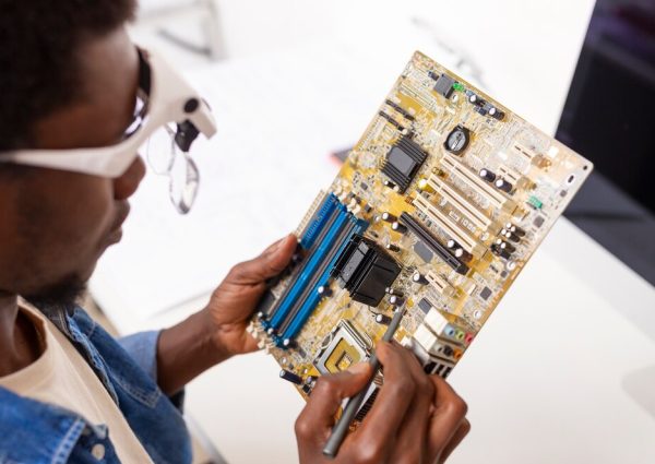 close-up-man-working-computer-chips_23-2150880930 (1)